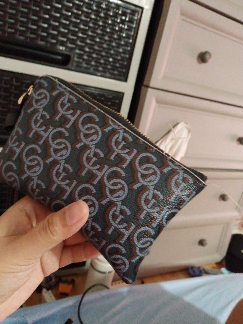 Monogram Pattern Zip Pouch Wallet (Category: Luxury Bags & Wallets) located in Manila. Submitted by russelsimo37305 (Listing ID 1464793686, Image 3). Description: - Stylish dark brown and light blue monogram design - Secure zipper closure for coins and cards - Convenient side wrist strap included - Compact size fits easily in larger bags or pockets - Clean and premium material texture.