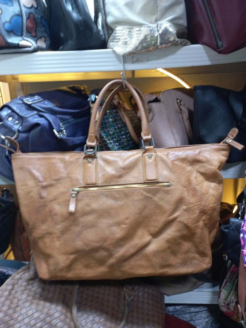 Monsac Brown Leather Tote Bag (Category: Tote Bags) located in Manila. Submitted by dei03_diz (Listing ID 1464939439, Image 2). Description: - Brand: Monsac - Material: Genuine Brown Leather - Interior: Roomy with stylish striped lining and a secure zip pocket - Exterior: Convenient back zip pocket for quick access - Hardware: Sturdy dual carry handles and protective bottom studs - Condition: Excellent / Ready to ship - Mode of Payment: GCash, .