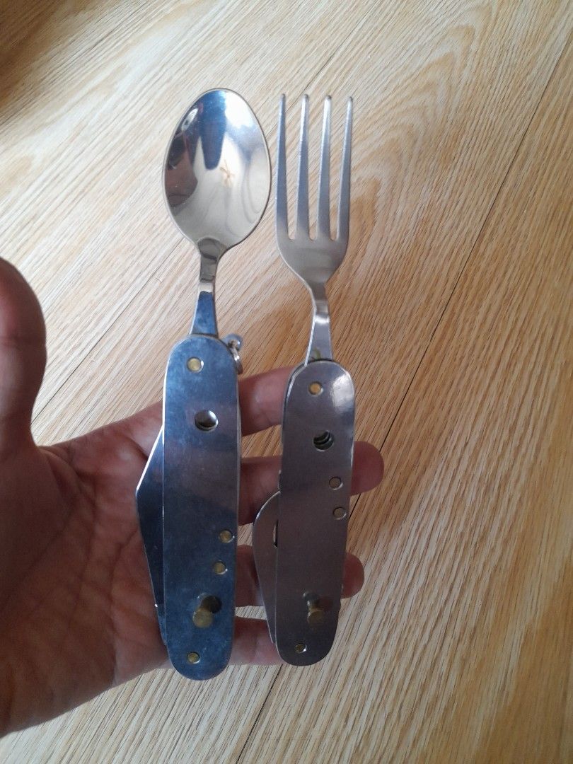 Multifunction Camping Cutlery Knife Fork Spoon Bottle Opener (Category: Hiking & Camping) located in Bocaue. Submitted by marajapansurplus (Listing ID 1464811341, Image 3). Description: - All-in-one outdoor tool: Combines fork, spoon, pocket knife, corkscrew, bottle opener, and awl - Dual-piece design: Splits apart so you can use the fork and knife at the same time - Built to last: Made of durable, rust-resistant stainless steel with sturdy metal
