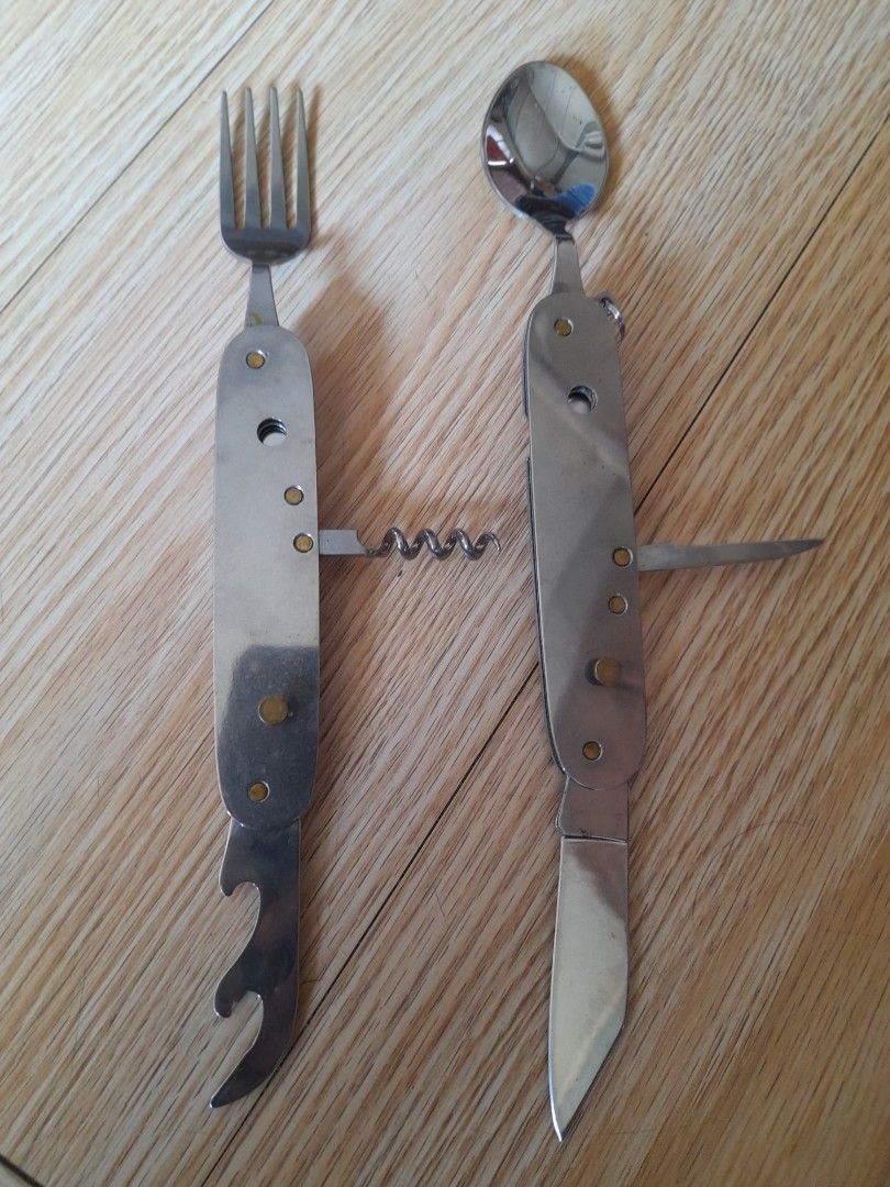 Multifunction Camping Cutlery Knife Fork Spoon Bottle Opener (Category: Hiking & Camping) located in Bocaue. Submitted by marajapansurplus (Listing ID 1464811341, Image 2). Description: - All-in-one outdoor tool: Combines fork, spoon, pocket knife, corkscrew, bottle opener, and awl - Dual-piece design: Splits apart so you can use the fork and knife at the same time - Built to last: Made of durable, rust-resistant stainless steel with sturdy metal