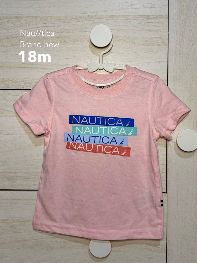 Nautica Pink Logo Tee (Category: Babies & Kids Fashion) located in Santa Rosa. Submitted by yasss23 (Listing ID 1464832732, Image 1). Description: - Brand: Nautica - Item: Toddler short sleeve t-shirt - Color: Pink with multi-colored logo graphic (blue, mint, light blue, and red) - Material: Soft cotton - Fit: Standard fit, crew neck - Condition: Brand new.