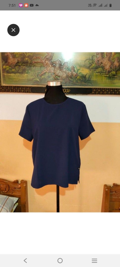 Navy Blue Short Sleeve Casual Blouse (Category: Blouses) located in Tabaco. Submitted by kooki24 (Listing ID 1464968705, Image 1). Description: - Color: Solid navy blue - Style: Casual, everyday wear - Design: Round neckline, short sleeves, and chic small side slits at the hem - Fabric: Lightweight, comfortable, and easy to pair with skirts or pants - Finish: Clean seams for a polished look.