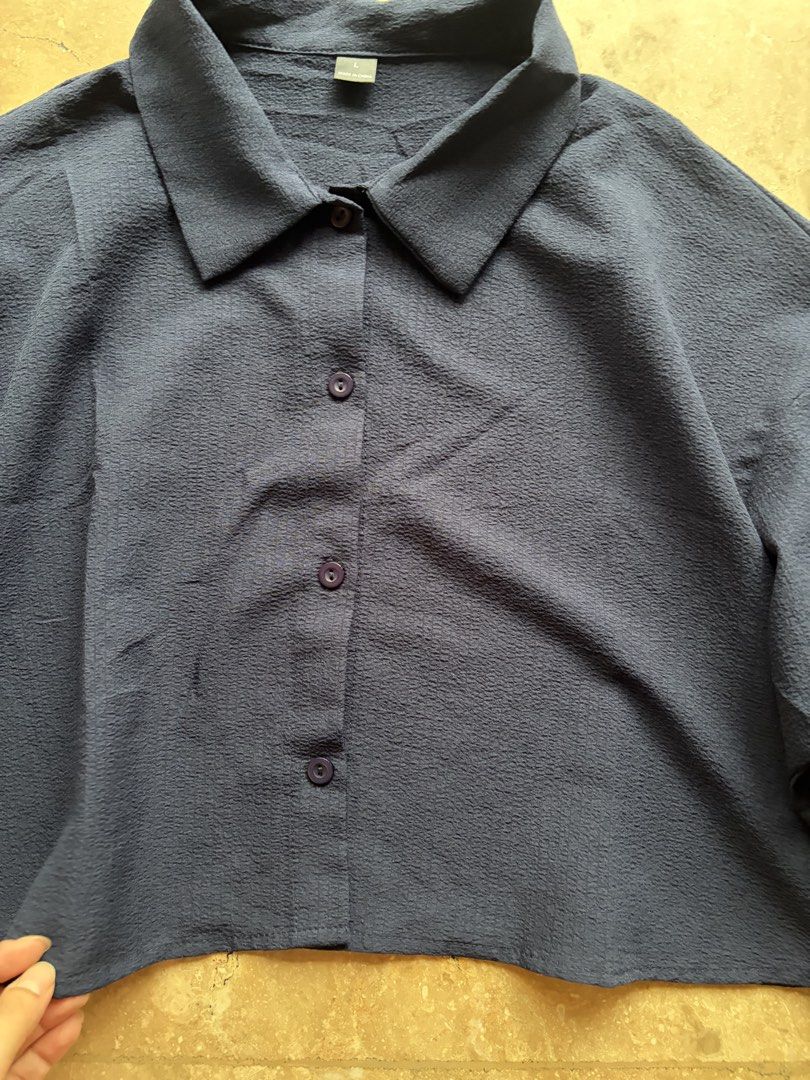 Navy Cropped Button-Up Blouse (Category: Others Tops) located in Quezon City. Submitted by tidyup.lara (Listing ID 1464966990, Image 2). Description: Size L Bust 40”+ Waist 40”+ Length 19” Condition 8/10: used but in good condition .