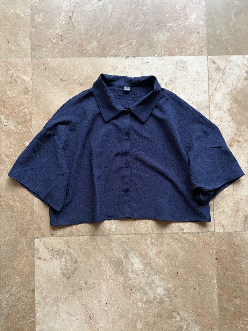 Navy Cropped Button-Up Blouse (Category: Others Tops) located in Quezon City. Submitted by tidyup.lara (Listing ID 1464966990, Image 1). Description: Size L Bust 40”+ Waist 40”+ Length 19” Condition 8/10: used but in good condition .