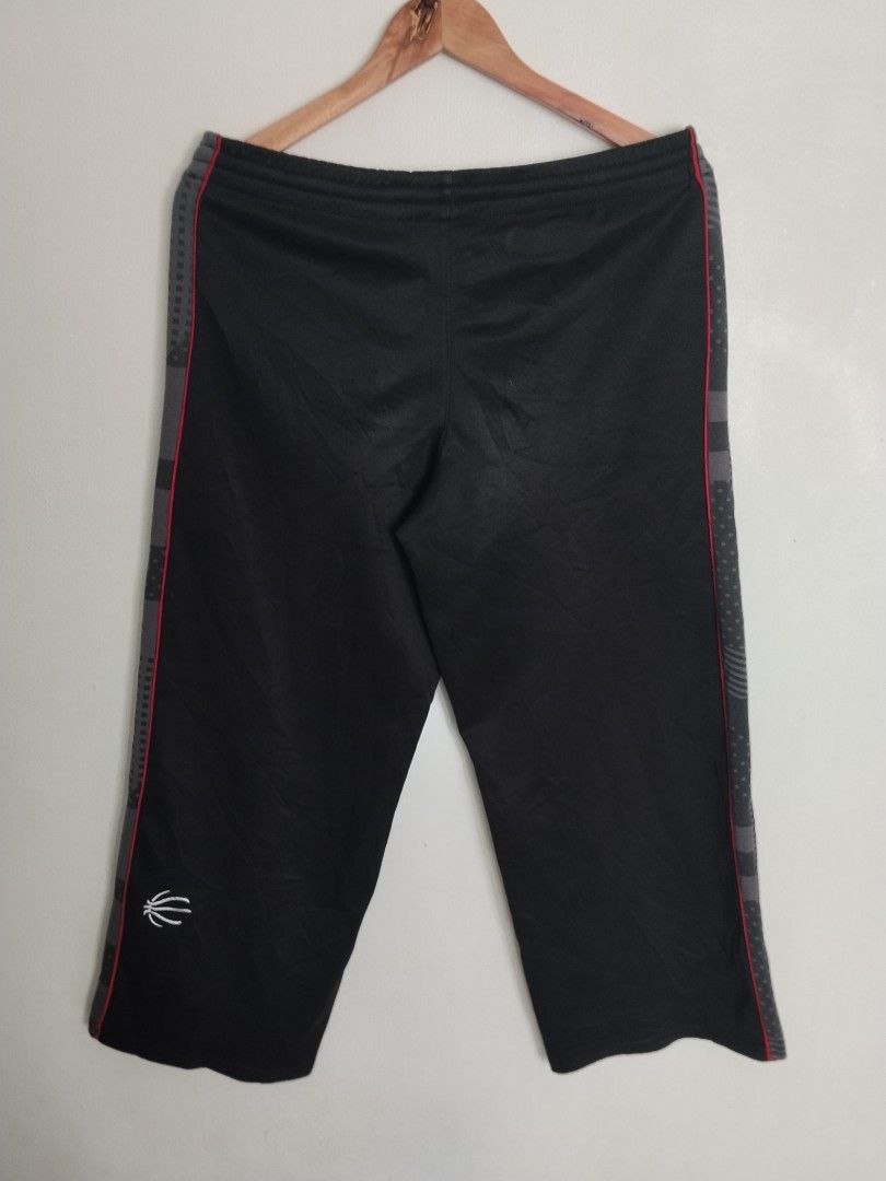 NBA Elevation Black Track Pants Size M (Category: Joggers) located in Bulacan. Submitted by waybak90s (Listing ID 1464776557, Image 3). Description: - Brand/Model: NBA Elevation Track Pants - Size: Medium (M) Dimes:W-30-34 L-34.5 - Color: Black with contrast grey side panels and red piping - Features: Adjustable drawstring waistband with NBA branding, subtle basketball graphic near hem, and white NBA logo on upper left leg - Fit: Relaxed fit - Co