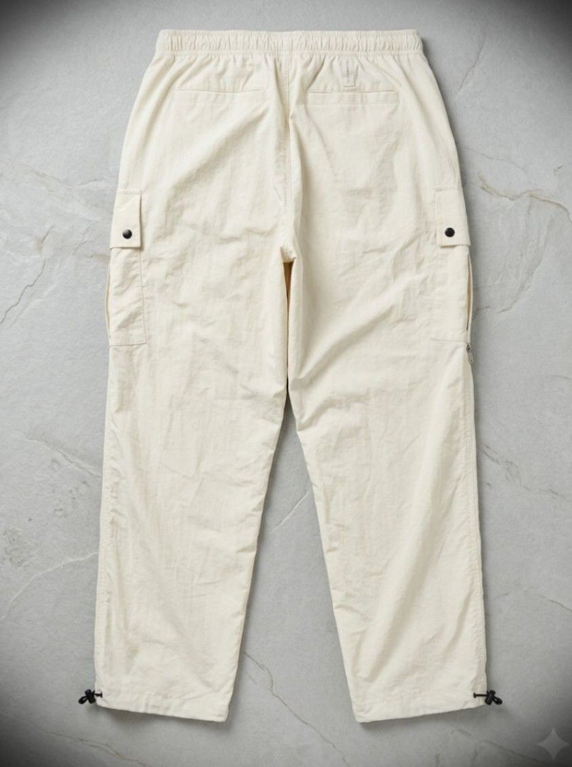 NBA Sportwear Tactical Nylon Outdoor Windbreaker Cargo Pants (Category: Jeans) located in Manila. Submitted by liliaplay (Listing ID 1464796052, Image 2). Description: Authentic! Pre-loved Imported 6 pockets water resistant engraved brand on snap buttons semi lightweight snap button pockets YBS zipper adjustable ankle Unisex (cream Color in Actual) size: 32-34 hem/rise: 13 length: 39.5 leghole: 7.5 No Issue other than that No Issue! Lowered to it