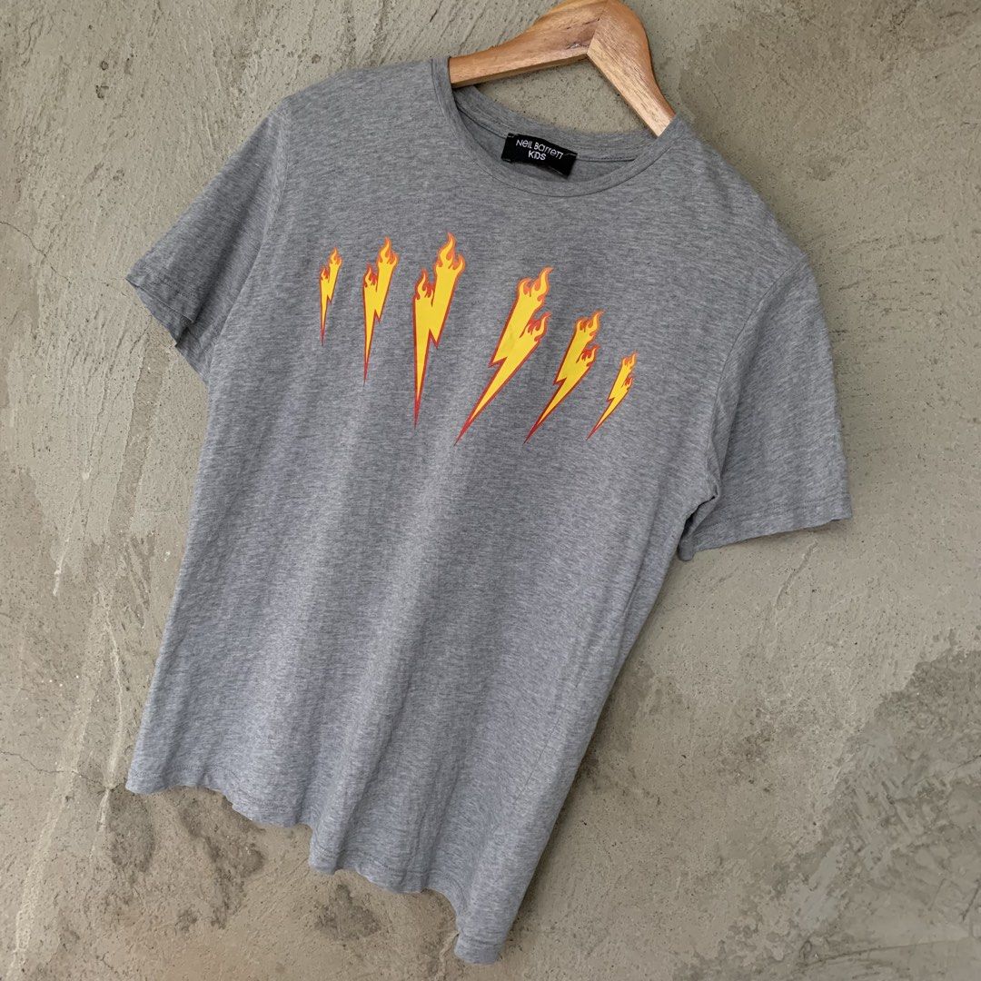 Neil Barrett Flame Lightning Bolt Baby Tee (Category: Shirts) located in Sindangan. Submitted by holy_thrift (Listing ID 1464829717, Image 1). Description: - Neil Barrett Flame Lightning Bolt Baby Tee - width / 18 - length / 24 - KIDS on tag fit sa S sa lalaki at S to M sa babae - no major issue sa 4th pic lang minimal crack sa back details - free shipping.