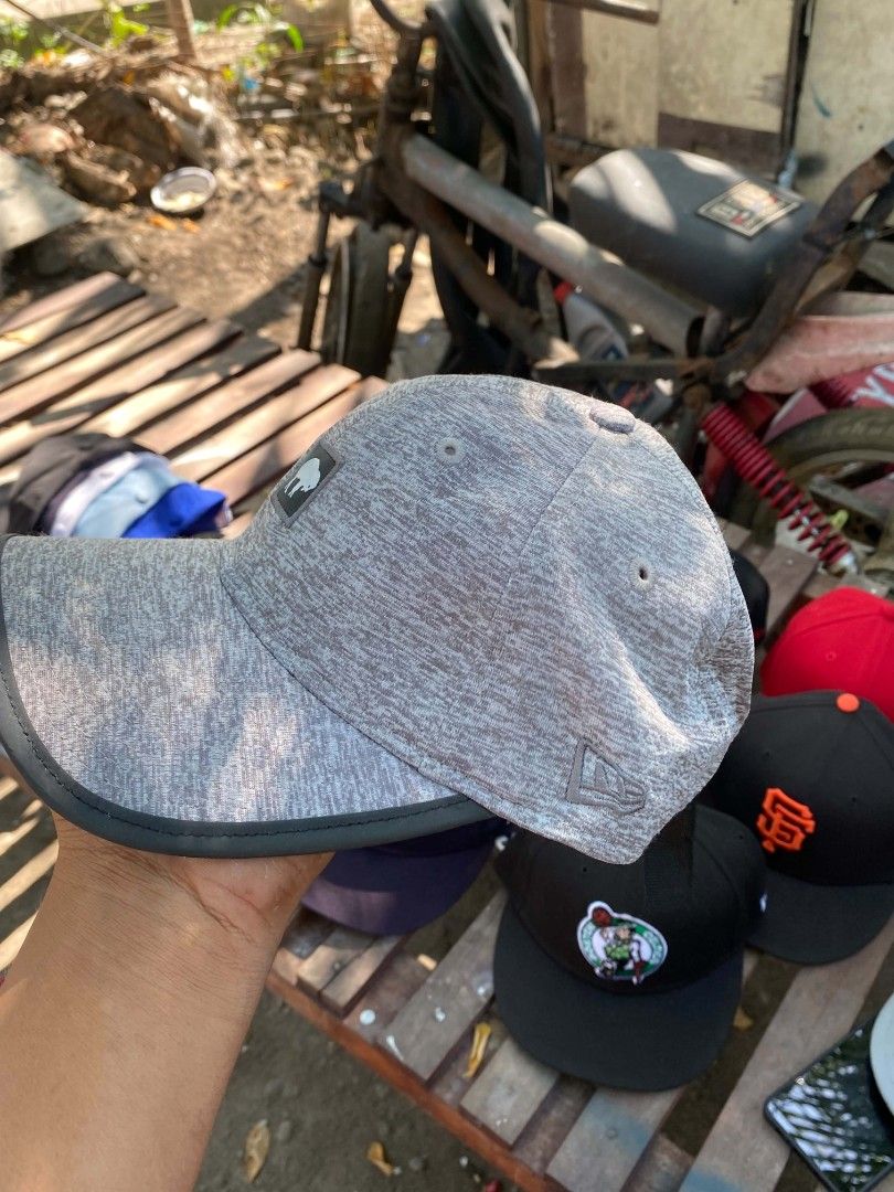 New Era 9Twenty One Buff Grey Cap (Category: Caps & Hats) located in Sibulan. Submitted by thethiftedcap0728 (Listing ID 1464887238, Image 2). Description: - Brand: New Era 9Twenty - Color: Grey heather textured with black strapback - Design: White buffalo logo patch on the front - Closure: Adjustable strap with plastic buckle - Authenticity: Official NFL tag sewn inside - Size: One size fits most.