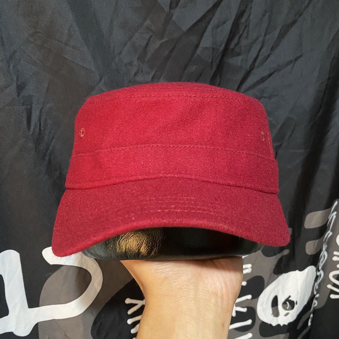 New Era Red Wool Cadet Cap Military Hat (Category: Caps & Hats) located in Villasis. Submitted by thriftngrind (Listing ID 1464910153, Image 3). Description: - Brand: New Era - Color: Deep burgundy red - Material: Solid wool - Style: Structured military-style cadet hat with a stiff brim - Details: Small silver metallic New Era flag logo pin and stitched eyelets for ventilation - Condition: Excellent, clean shape - Best for: Casual wear and colder