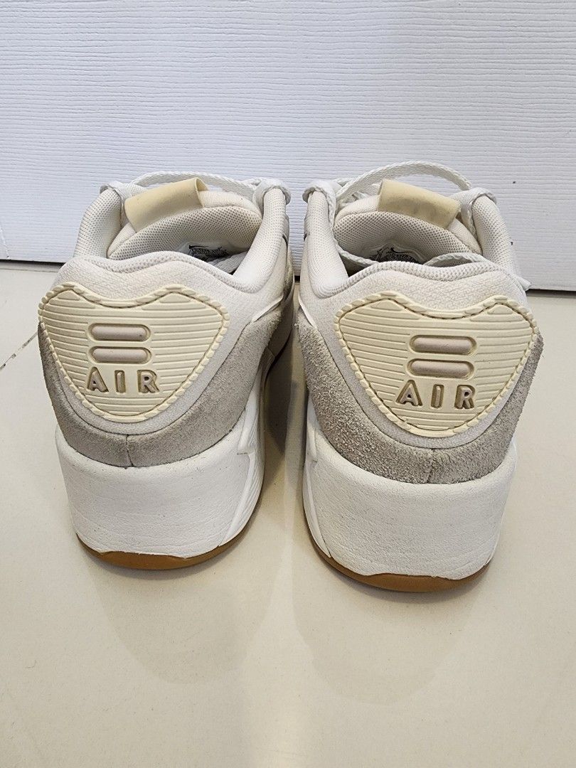 Nike Air Max 90 LV8 Size 7 (Category: Sneakers) located in Quezon City. Submitted by pinkyshang (Listing ID 1464837166, Image 3). Description: - Brand/Model: Nike Air Max 90 LV8 Size 7 - Colorway: Clean White and Cream - Materials: Classic leather and suede upper with gum rubber waffle outsole - Features: Visible Air unit in the heel for comfort and great grip - Condition: Overall clean uppers, strong tread on soles, and minor fading on the Nike 