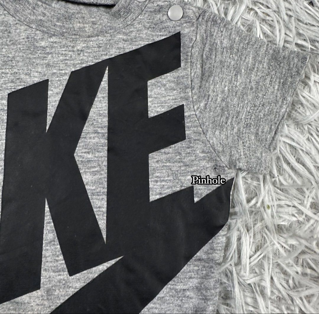 Nike Baby Grey Romper Size 3M (Category: Babies & Kids Fashion) located in Cavite. Submitted by littleangelco. (Listing ID 1464928966, Image 2). Description: - Brand: Nike - Item: Baby Romper - Color: Grey with black logo - Size: 3M - Features: Short sleeves, snap buttons at shoulder and bottom for easy changing - Flaw: Small pinhole near the right sleeve area next to the logo.