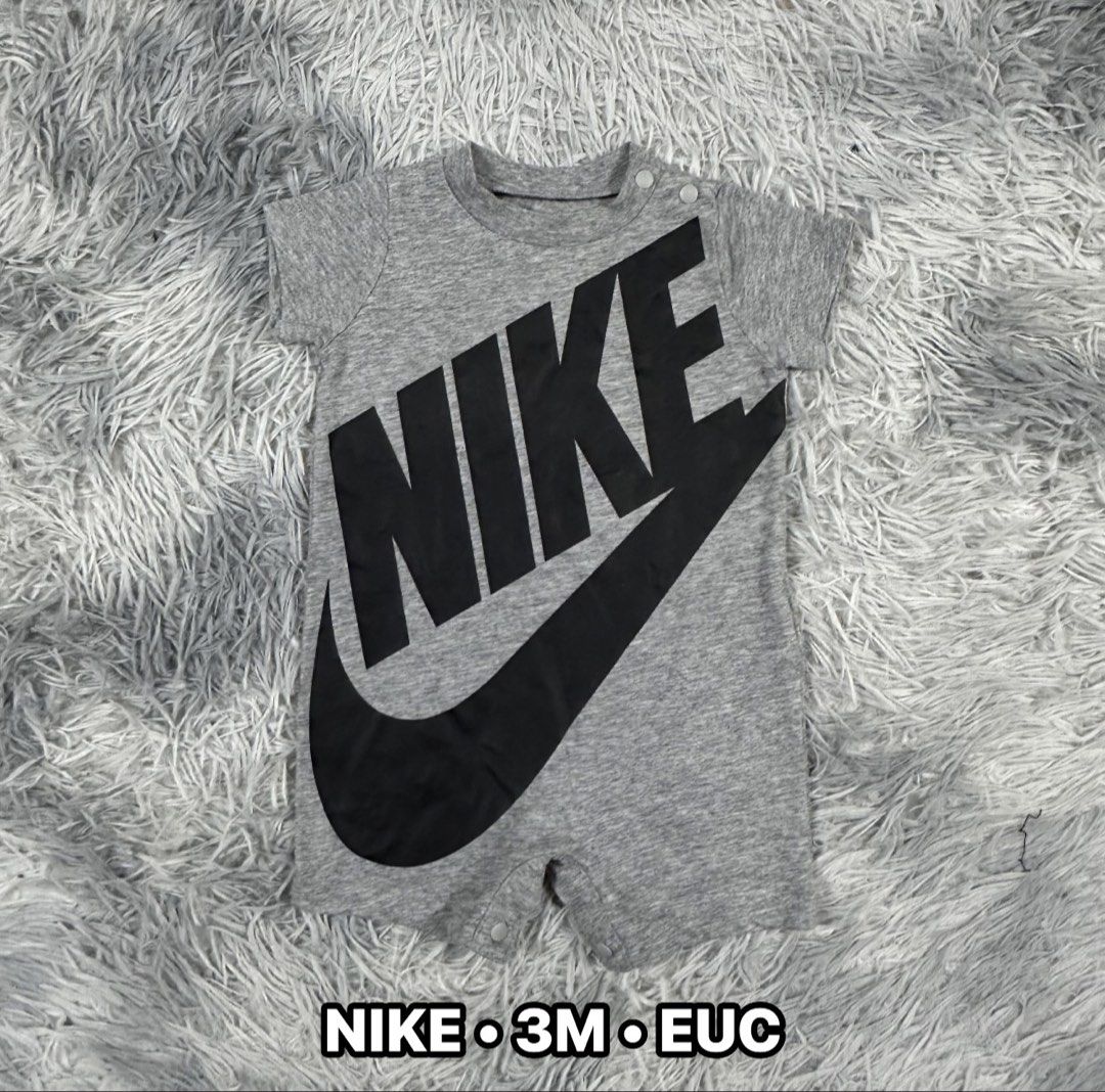 Nike Baby Grey Romper Size 3M (Category: Babies & Kids Fashion) located in Cavite. Submitted by littleangelco. (Listing ID 1464928966, Image 1). Description: - Brand: Nike - Item: Baby Romper - Color: Grey with black logo - Size: 3M - Features: Short sleeves, snap buttons at shoulder and bottom for easy changing - Flaw: Small pinhole near the right sleeve area next to the logo.