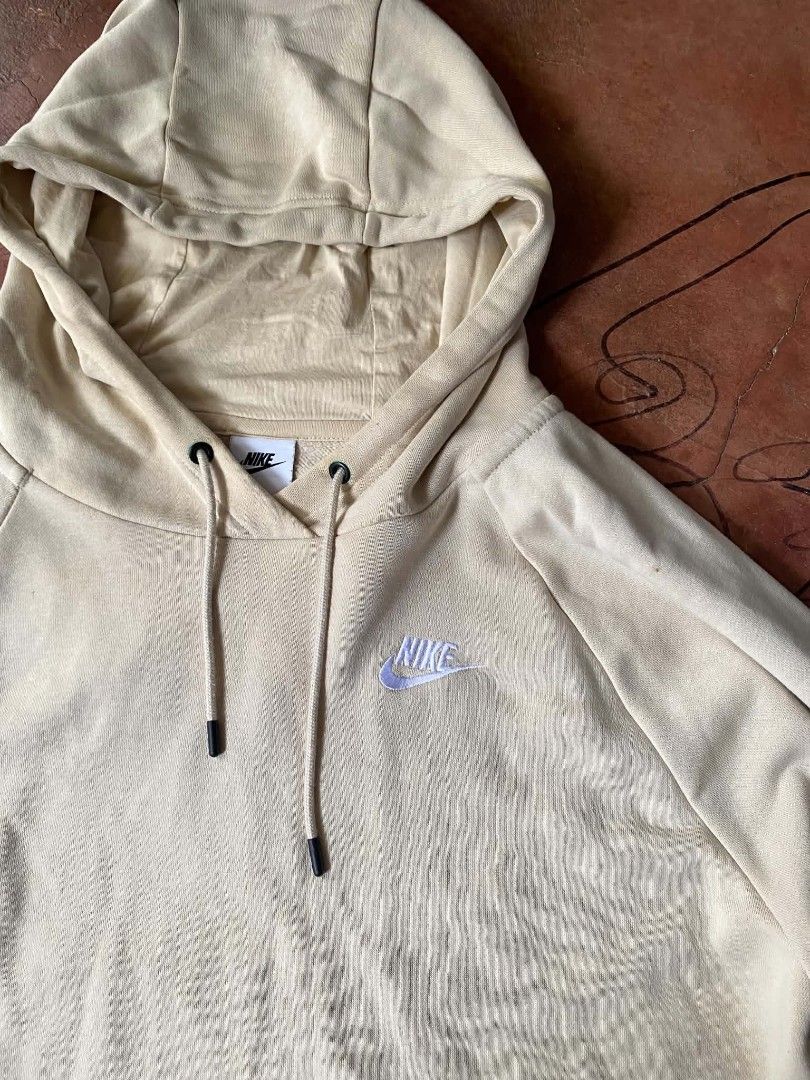 Nike Beige Hoodie (Category: Hoodies) located in Gumaca. Submitted by makuliti (Listing ID 1464793175, Image 2). Description: - Brand: Nike - Color: Beige - Size: 1X (Tag on inside collar) - Material: 80% Cotton, 20% Polyester (Made in Vietnam) - Features: Embroidered Nike logo - Condition: Pre-loved with a few small stains on the front body near the center - Perfect for casual, everyday streetwear.