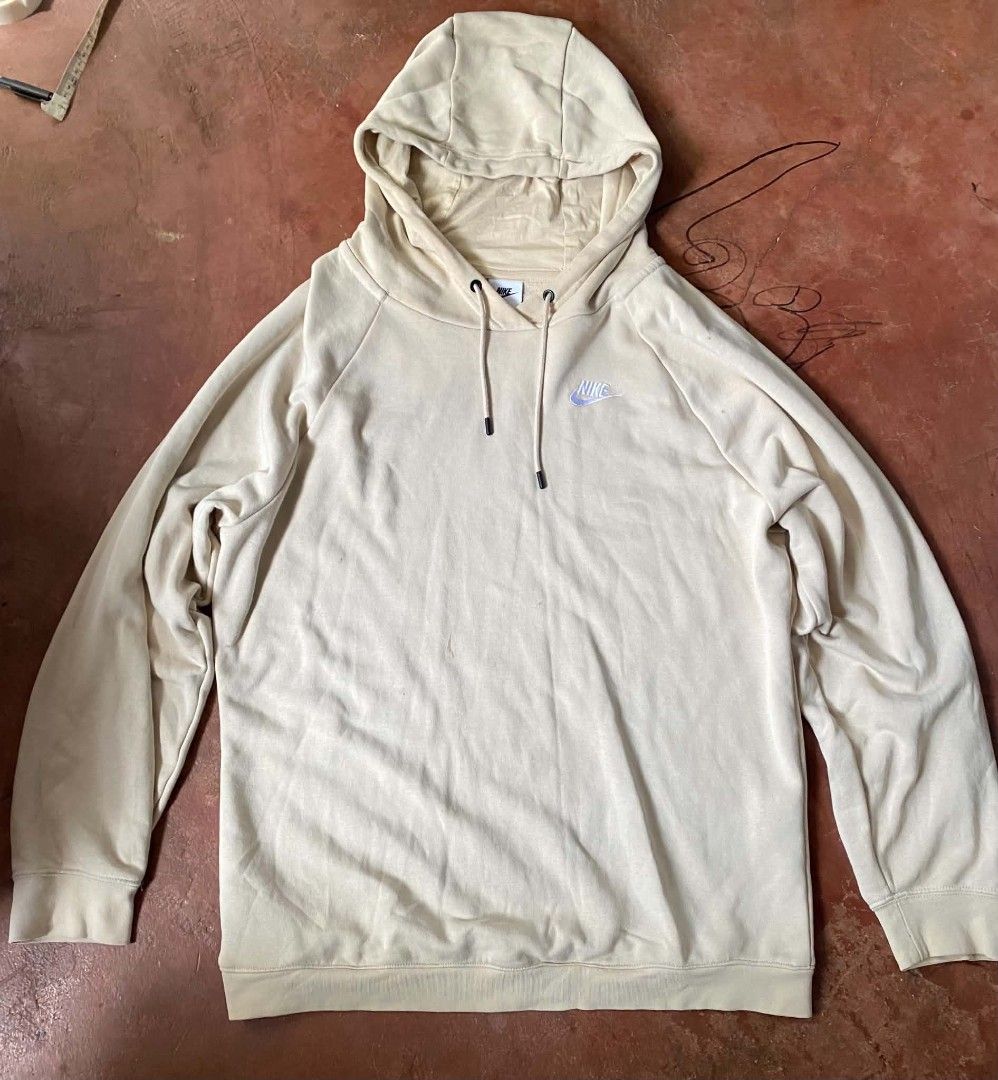 Nike Beige Hoodie (Category: Hoodies) located in Gumaca. Submitted by makuliti (Listing ID 1464793175, Image 1). Description: - Brand: Nike - Color: Beige - Size: 1X (Tag on inside collar) - Material: 80% Cotton, 20% Polyester (Made in Vietnam) - Features: Embroidered Nike logo - Condition: Pre-loved with a few small stains on the front body near the center - Perfect for casual, everyday streetwear.