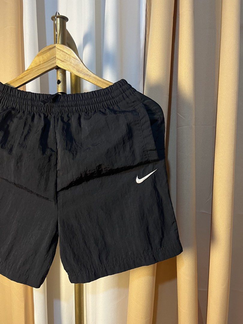 Nike Black Nylon Shorts Size L (Category: Shorts) located in Kidapawan. Submitted by azythrift (Listing ID 1464914545, Image 2). Description: - Brand: Nike - Style/Code: FB1327-010 - Size: Large - Color: Black with embroidered white Swoosh logo - Origin: Made in Vietnam - Material: Lightweight fabric with inner mesh lining - Features: Comfortable elastic waistband - Condition: Brand new/clean with tags intact.