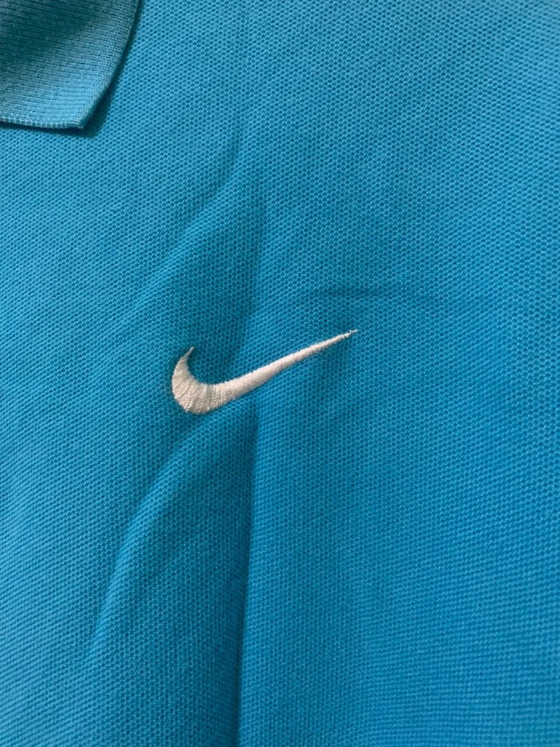 Nike Blue Polo Shirt (Category: Tshirts & Polo Shirts ) located in Daraga. Submitted by ryrilim (Listing ID 1464928125, Image 2). Description: - Brand: Nike - Color: Bright blue - Material: 100% cotton (comfortable everyday wear) - Design: Classic collar, two-button placket, embroidered white Nike swoosh on chest - Details: Small black tag near bottom hem, inner collar size tag - Origin: Made in Vietnam - Condition: Excellent basic wardrobe stapl