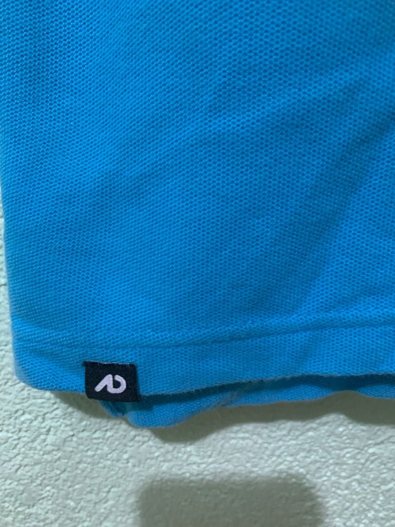 Nike Blue Polo Shirt (Category: Tshirts & Polo Shirts ) located in Daraga. Submitted by ryrilim (Listing ID 1464928125, Image 3). Description: - Brand: Nike - Color: Bright blue - Material: 100% cotton (comfortable everyday wear) - Design: Classic collar, two-button placket, embroidered white Nike swoosh on chest - Details: Small black tag near bottom hem, inner collar size tag - Origin: Made in Vietnam - Condition: Excellent basic wardrobe stapl