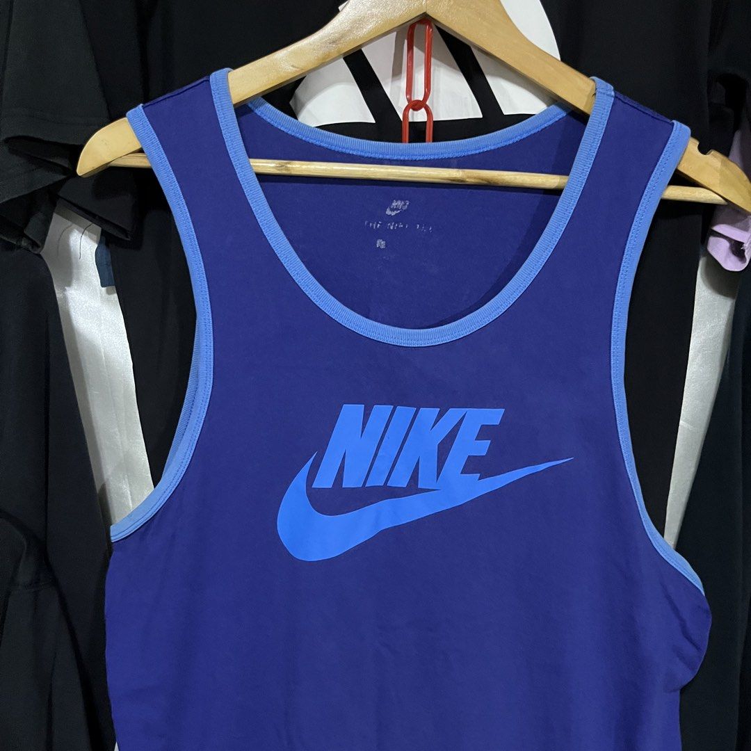 Nike Blue Tank Top Size L (Category: Sleeveless) located in Caloocan City. Submitted by ayogorenia1002 (Listing ID 1464944580, Image 2). Description: - Brand: Nike - Color: Royal blue with light blue trim - Size: Large - Design: Big Nike swoosh logo on the front chest - Condition: Clean and ready to wear - Ideal for: Workouts, gym sessions, or casual summer days.