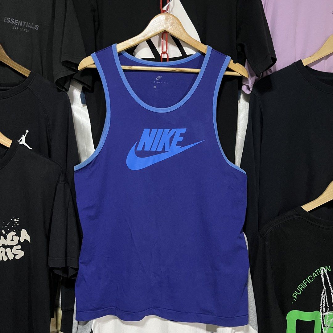 Nike Blue Tank Top Size L (Category: Sleeveless) located in Caloocan City. Submitted by ayogorenia1002 (Listing ID 1464944580, Image 1). Description: - Brand: Nike - Color: Royal blue with light blue trim - Size: Large - Design: Big Nike swoosh logo on the front chest - Condition: Clean and ready to wear - Ideal for: Workouts, gym sessions, or casual summer days.