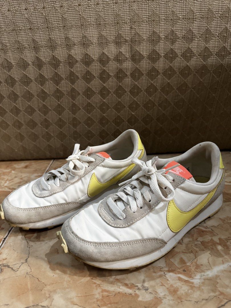 Nike Daybreak White Yellow Grey Sneakers (Category: Sneakers) located in Bacolod City. Submitted by lovedandprelovedbygee (Listing ID 1464850581, Image 3). Description: - Brand: Nike - Model: Daybreak - Colorway: White, grey, and yellow with bright orange tongue and neon yellow heel tab - Details: Suede overlays, pink Nike text on heel, textured waffle rubber sole, and white laces included - Condition: Normal signs of wear on uppers and midsoles 