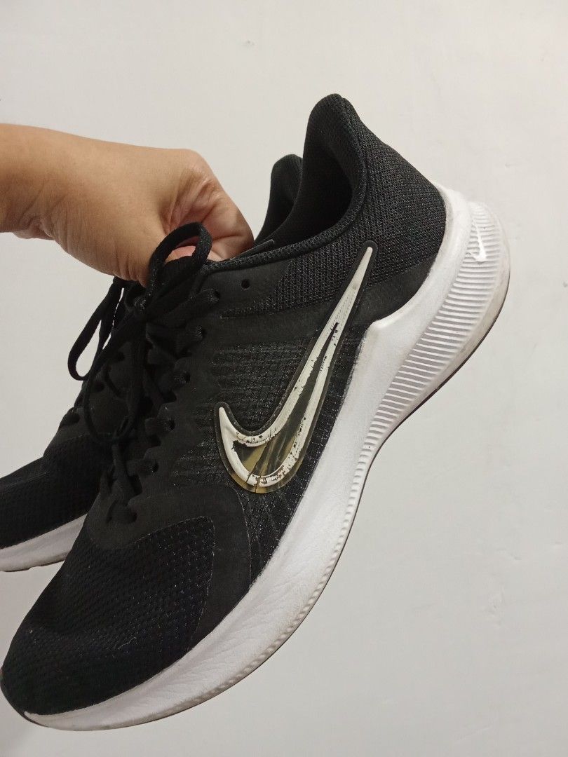 Nike Downshifter Black Running Shoes (Category: Sneakers) located in Quezon City. Submitted by jane019 (Listing ID 1464917118, Image 3). Description: Nike Downshifter running shoes in black. White midsoles with textured black rubber outsoles for grip. Breathable mesh upper construction. Lace-up closure up front. White Nike swoosh logos along the sides. Light wear on the soles, plenty of mileage left in them. Actual pics posted needs cleaning loca