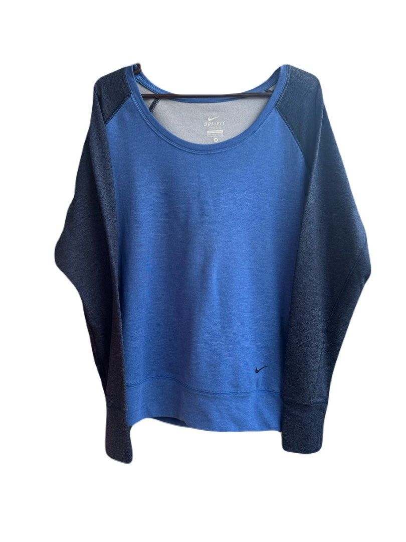 Nike Dri-FIT Long Sleeve Raglan (Category: Activewear) located in La Trinidad. Submitted by whatnotcollections (Listing ID 1464905676, Image 2). Description: - Brand: Nike - Tech: Dri-Fit moisture-wicking - Color: Two tone. Blue front with dark blue sleeves and back - Size: Medium (tagless collar) - Design: Scoop neck, raglan long sleeves, small Nike swoosh near hem and a secret mini pocket. - Condition: Excellent - Perfect for: Gym workouts, run