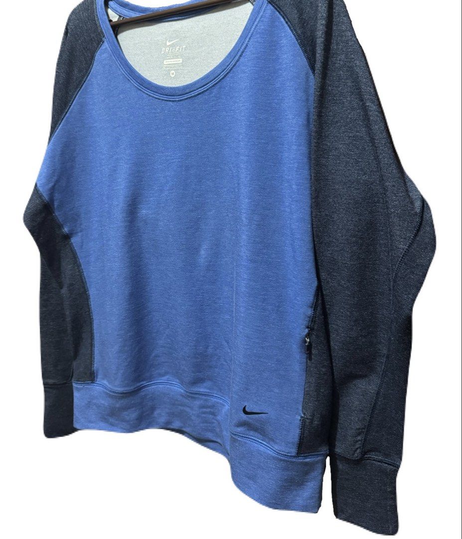 Nike Dri-FIT Long Sleeve Raglan (Category: Activewear) located in La Trinidad. Submitted by whatnotcollections (Listing ID 1464905676, Image 3). Description: - Brand: Nike - Tech: Dri-Fit moisture-wicking - Color: Two tone. Blue front with dark blue sleeves and back - Size: Medium (tagless collar) - Design: Scoop neck, raglan long sleeves, small Nike swoosh near hem and a secret mini pocket. - Condition: Excellent - Perfect for: Gym workouts, run