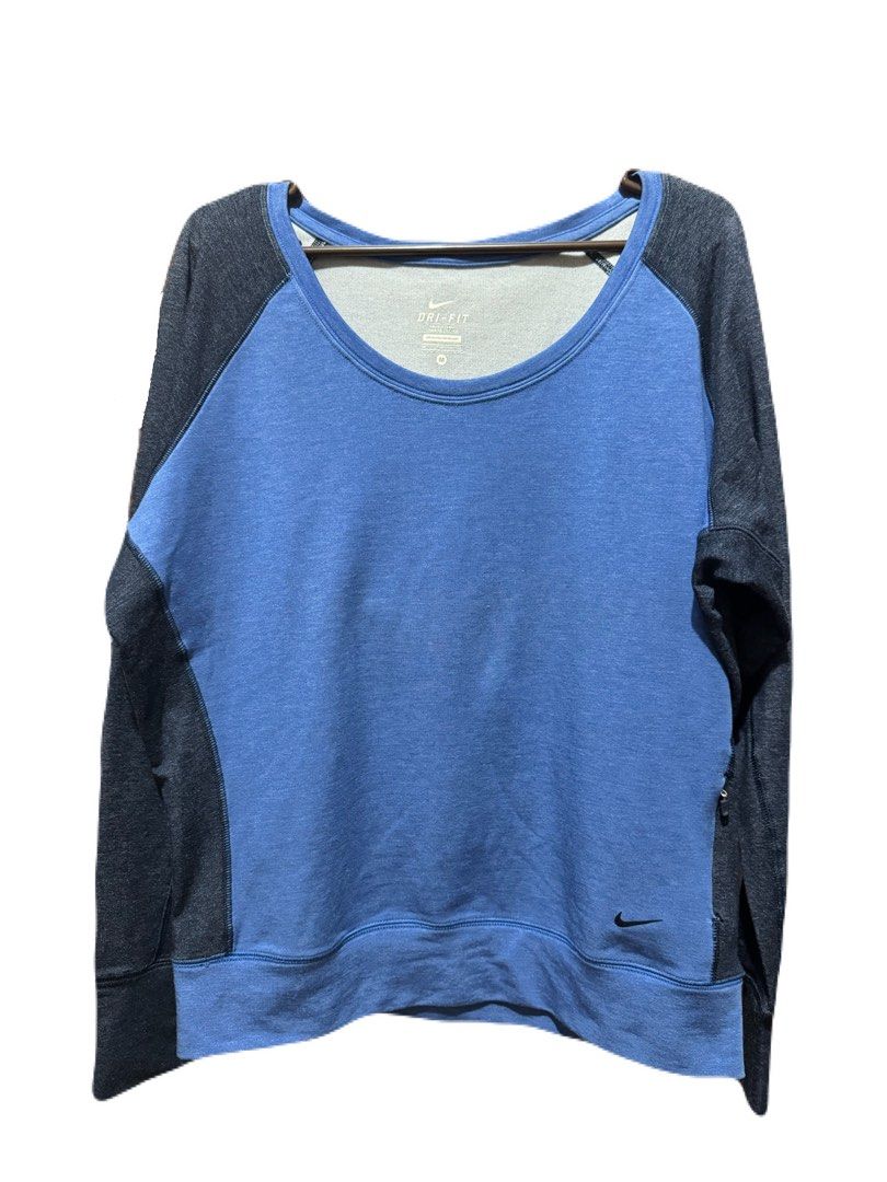Nike Dri-FIT Long Sleeve Raglan (Category: Activewear) located in La Trinidad. Submitted by whatnotcollections (Listing ID 1464905676, Image 1). Description: - Brand: Nike - Tech: Dri-Fit moisture-wicking - Color: Two tone. Blue front with dark blue sleeves and back - Size: Medium (tagless collar) - Design: Scoop neck, raglan long sleeves, small Nike swoosh near hem and a secret mini pocket. - Condition: Excellent - Perfect for: Gym workouts, run