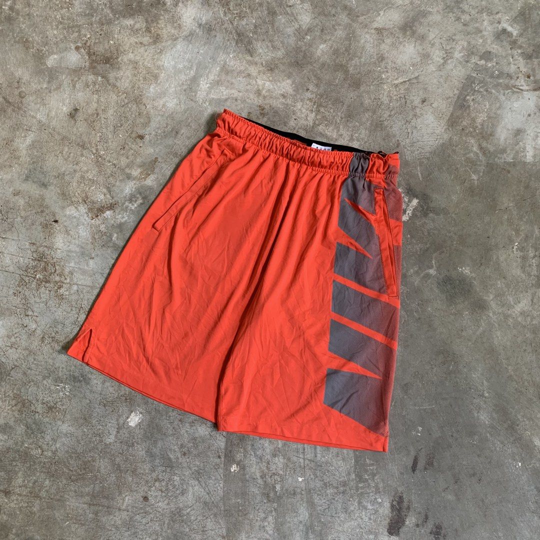 Nike Dri-FIT Orange Athletic Shorts (Category: Shorts) located in Manila. Submitted by emplysthrift. (Listing ID 1464905252, Image 3). Description: Actual dimes on tapemeasure Waist "29 to 32 Length "20 Good Condition Colorrate: 9.2/10 Flaws: minor heeldrag on gart part Unli vouch/vc for safe transactions 📲 Location: Laspinas City, Metro Manila, Brngy Talon Uno. 📍 DM IF INTERESTED📥 - Brand: Nike - Color: Bright orange with grey side panels - S