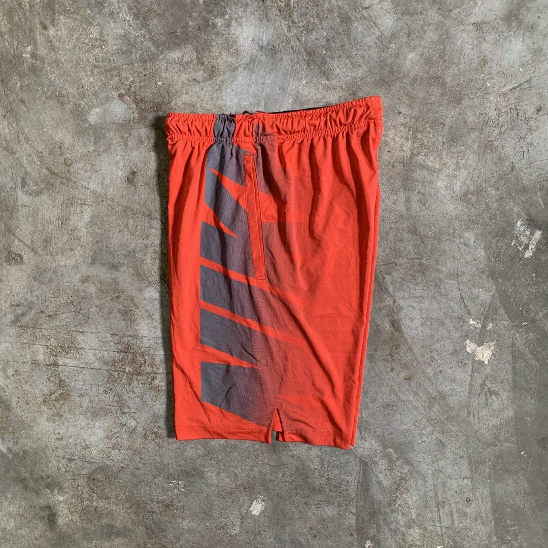 Nike Dri-FIT Orange Athletic Shorts (Category: Shorts) located in Manila. Submitted by emplysthrift. (Listing ID 1464905252, Image 1). Description: Actual dimes on tapemeasure Waist "29 to 32 Length "20 Good Condition Colorrate: 9.2/10 Flaws: minor heeldrag on gart part Unli vouch/vc for safe transactions 📲 Location: Laspinas City, Metro Manila, Brngy Talon Uno. 📍 DM IF INTERESTED📥 - Brand: Nike - Color: Bright orange with grey side panels - S