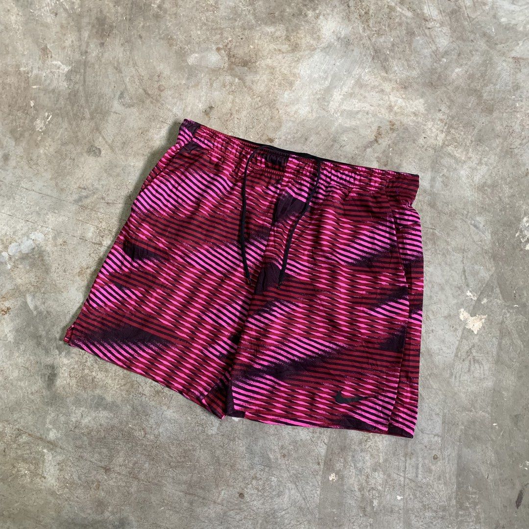 Nike Dri-FIT Pink Patterned Athletic Shorts XL (Category: Shorts) located in Manila. Submitted by emplysthrift. (Listing ID 1464909676, Image 2). Description: Waist "36.5 Length "18.5 Excellent Condition Colorrate: 9.5/10 Flaws: nine Unli vouch/vc for safe transactions 📲 Location: Laspinas City, Metro Manila, Brngy Talon Uno. 📍 DM IF INTERESTED📥 - Brand: Nike - Size: XL - Color/Pattern: Pink and dark red graphic stripe - Material: Dri-FIT mois