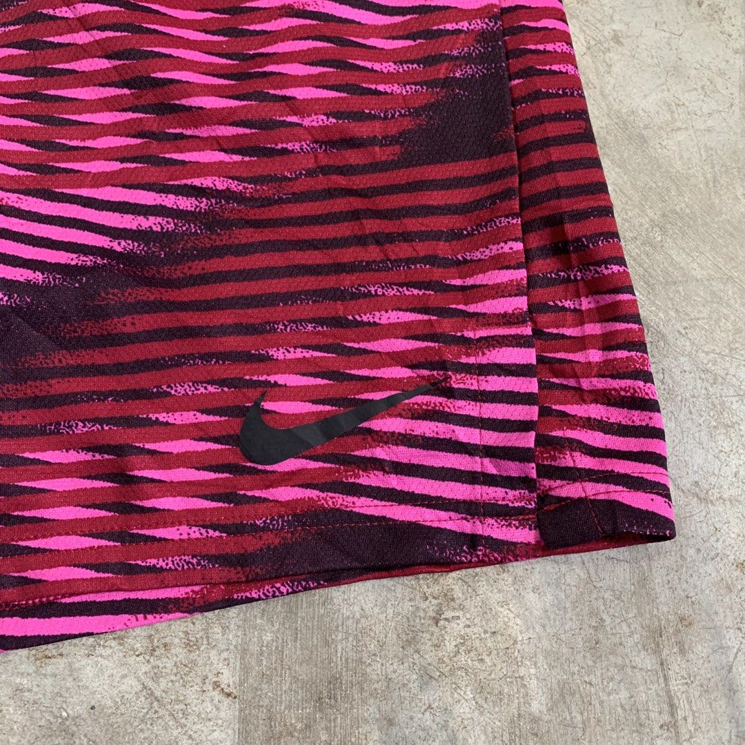 Nike Dri-FIT Pink Patterned Athletic Shorts XL (Category: Shorts) located in Manila. Submitted by emplysthrift. (Listing ID 1464909676, Image 3). Description: Waist "36.5 Length "18.5 Excellent Condition Colorrate: 9.5/10 Flaws: nine Unli vouch/vc for safe transactions 📲 Location: Laspinas City, Metro Manila, Brngy Talon Uno. 📍 DM IF INTERESTED📥 - Brand: Nike - Size: XL - Color/Pattern: Pink and dark red graphic stripe - Material: Dri-FIT mois