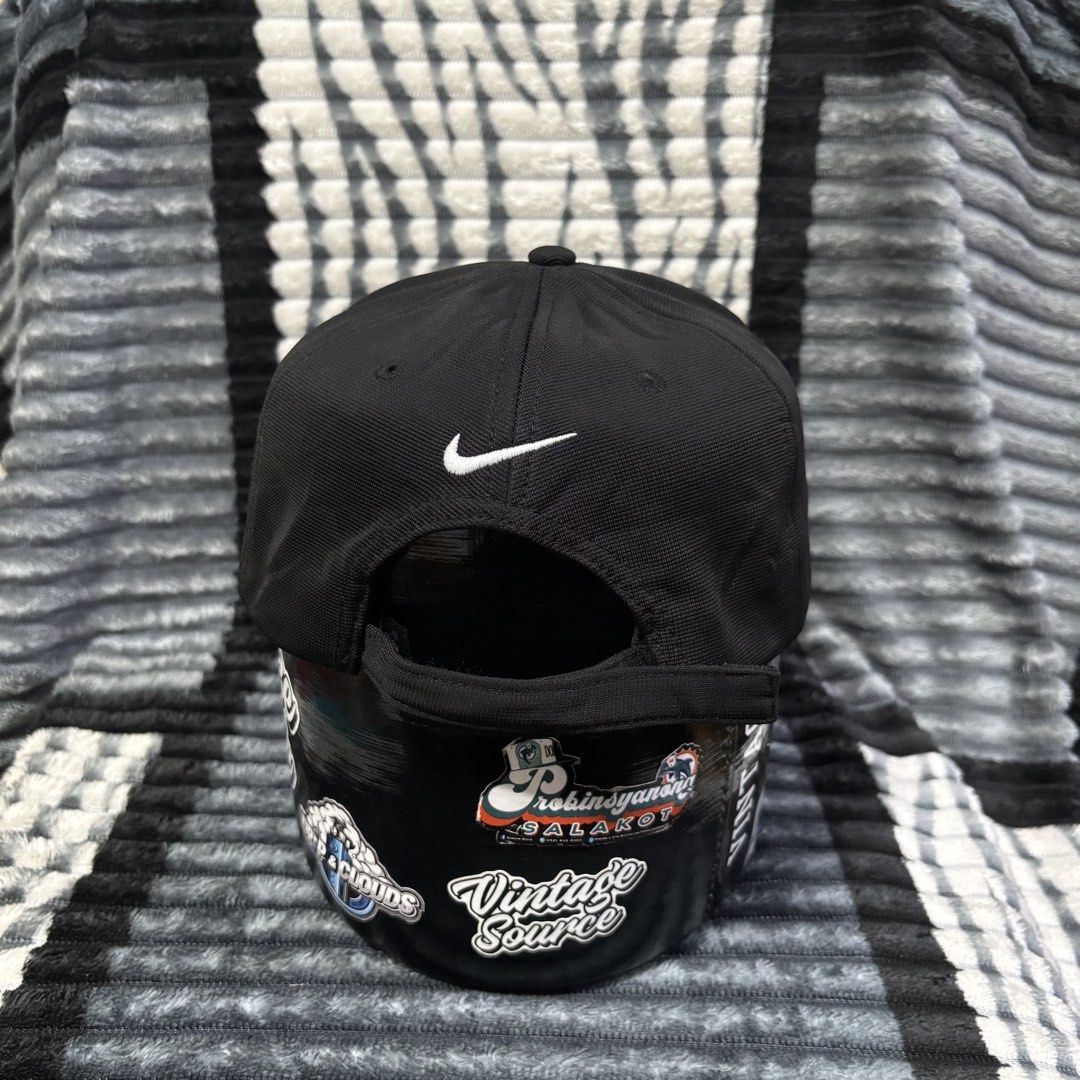 Nike Golf Black Cap with White Swoosh (Category: Caps & Hats) located in Iligan City. Submitted by 9200rsnl (Listing ID 1464798175, Image 2). Description: - Authentic Nike Golf cap in classic black - Features iconic white embroidered swoosh on front and back - Adjustable strap closure for a custom, comfortable fit - Lightweight and breathable fabric ideal for outdoor sports or casual wear - Clean structure with a standard curved brim - Verified N