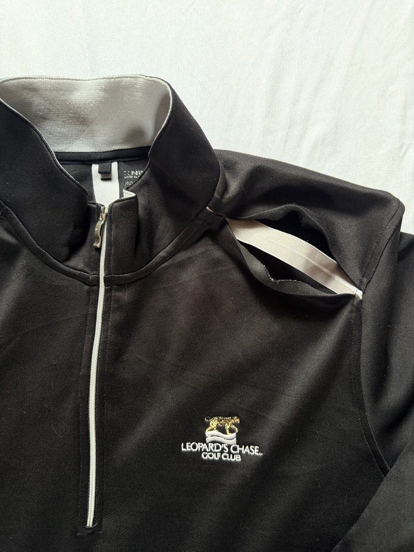 Nike Golf Leopard's Chase Half Zip Pullover (Category: Coats, Jackets and Outerwear) located in Santa Rosa. Submitted by itskllycstll (Listing ID 1464912201, Image 2). Description: - Brand: Nike Golf - Color: Black with grey inner collar and zipper piping - Material: Dri-FIT moisture-wicking fabric - Details: Leopard's Chase Golf Club embroidered logo on chest, white Nike swoosh on sleeve - Mobility: Shoulder vents with white stretch tape underne