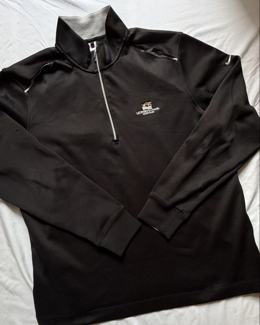 Nike Golf Leopard's Chase Half Zip Pullover (Category: Coats, Jackets and Outerwear) located in Santa Rosa. Submitted by itskllycstll (Listing ID 1464912201, Image 1). Description: - Brand: Nike Golf - Color: Black with grey inner collar and zipper piping - Material: Dri-FIT moisture-wicking fabric - Details: Leopard's Chase Golf Club embroidered logo on chest, white Nike swoosh on sleeve - Mobility: Shoulder vents with white stretch tape underne