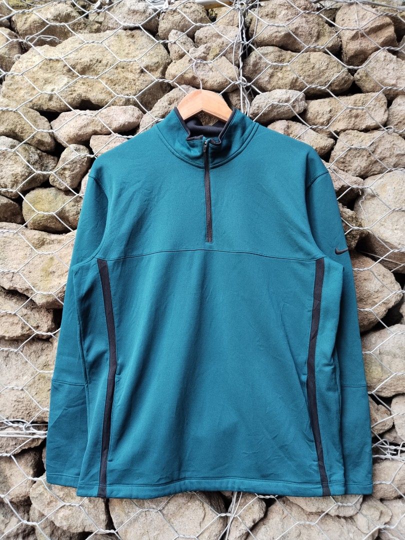 Nike Golf Therma-Fit Quarter Zip Teal Pullover Medium (Category: Coats, Jackets and Outerwear) located in Manila. Submitted by carlmichae22397 (Listing ID 1464776464, Image 1). Description: - Brand: Nike Golf - Style: Quarter-zip pullover - Color: Teal with black contrast zipper, collar trim, and side panel accents - Technology: Therma-Fit for warmth on the course - Details: Subtle black embroidered swoosh on the left sleeve - Size: Medium (tag p