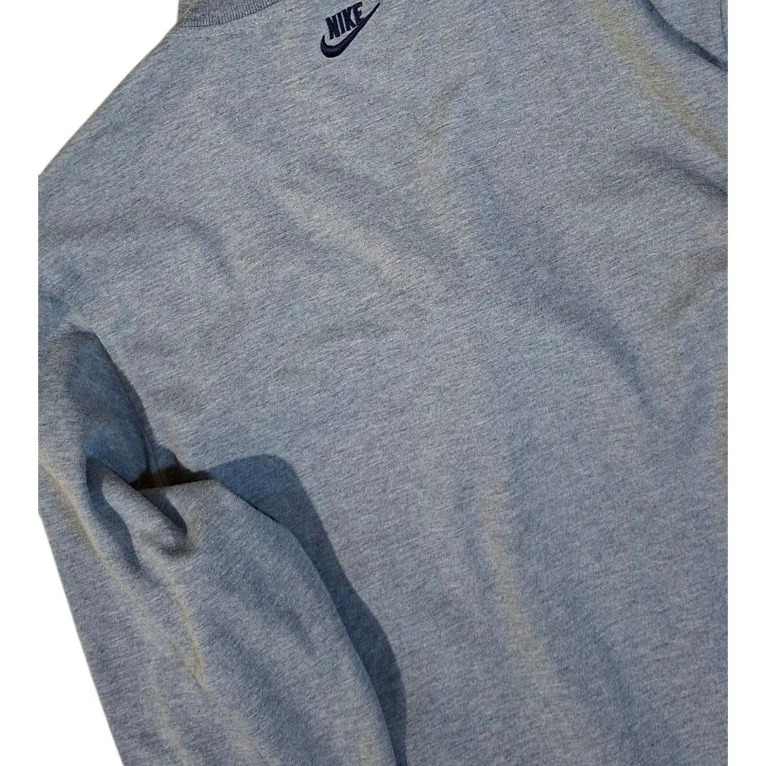 Nike Gray Track Jacket Full Zip XL (Category: Coats, Jackets and Outerwear) located in Manila. Submitted by joshbelgic17602 (Listing ID 1464935633, Image 2). Description: - Brand: Nike - Style: Full-zip track jacket - Color: Gray with black piping details - Size: XL - Logos: Small embroidered Nike logo on left chest, cursive Nike print on right shoulder - Pockets: Two side welt pockets - Details: Ribbed cuffs and hem - Condition: Clean fabric and