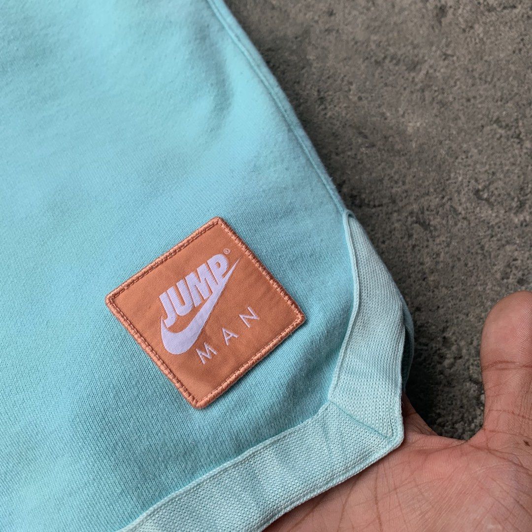Nike Jordan Jumpman Two-Tone Blue Drawstring Shorts (Category: Shorts) located in Polangui. Submitted by b0ssl00ts (Listing ID 1464806067, Image 3). Description: - Brand: Jordan - Colorway: Two-tone light blue and teal - Material: Soft fleece-like cotton - Features: Elastic waistband with adjustable drawstring - Pockets: Deep pockets on both sides - Branding: Distinctive orange/white Jumpman patch on lower left leg and subtle white Jumpman embroi