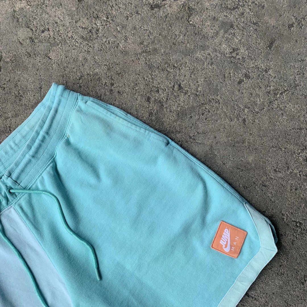 Nike Jordan Jumpman Two-Tone Blue Drawstring Shorts (Category: Shorts) located in Polangui. Submitted by b0ssl00ts (Listing ID 1464806067, Image 2). Description: - Brand: Jordan - Colorway: Two-tone light blue and teal - Material: Soft fleece-like cotton - Features: Elastic waistband with adjustable drawstring - Pockets: Deep pockets on both sides - Branding: Distinctive orange/white Jumpman patch on lower left leg and subtle white Jumpman embroi