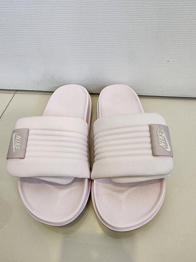Nike Offcourt Adjust Slides Size 7 (Category: Slippers and slides) located in Quezon City. Submitted by pinkyshang (Listing ID 1464896452, Image 1). Description: - Model: Nike Offcourt Adjust Slides Size 7 - Color: Pink - Style Code: DV1033-600 - Size: Women's US 7 / UK 4.5 / EUR 38 / CM 24 - Condition: Clean soles with slight wear on the inner footbeds - Features: Revive foam footbed, textured strap with velcro adjustment and circular traction o