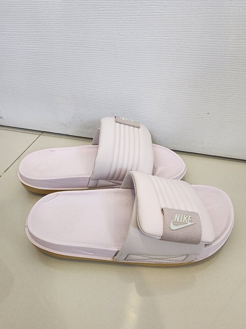 Nike Offcourt Adjust Slides Size 7 (Category: Slippers and slides) located in Quezon City. Submitted by pinkyshang (Listing ID 1464896452, Image 2). Description: - Model: Nike Offcourt Adjust Slides Size 7 - Color: Pink - Style Code: DV1033-600 - Size: Women's US 7 / UK 4.5 / EUR 38 / CM 24 - Condition: Clean soles with slight wear on the inner footbeds - Features: Revive foam footbed, textured strap with velcro adjustment and circular traction o