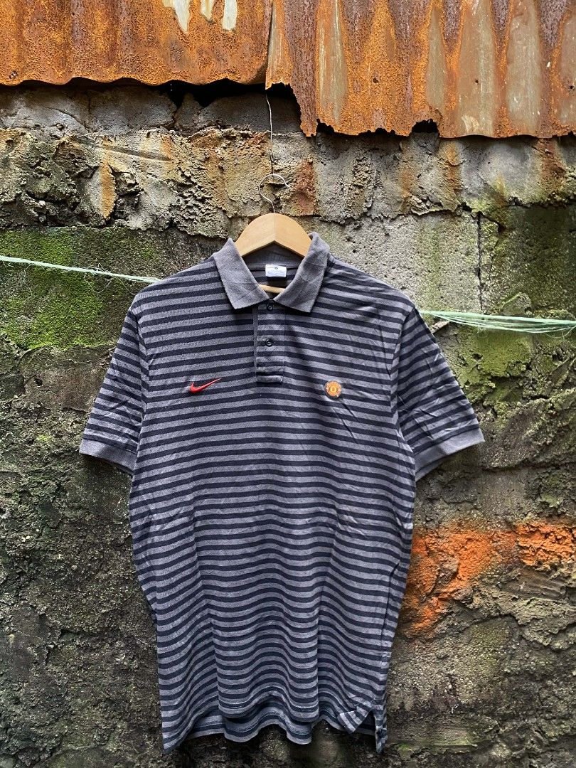 Nike polo Manchester stripes (Category: Tshirts & Polo Shirts ) located in Manila. Submitted by thriftnicarl.3 (Listing ID 1464916005, Image 1). Description: Nike polo stripes Manchester united sizes - large dimes - W 20.5 L 28.7 price - 499 Free ship via jnt 🏷️.