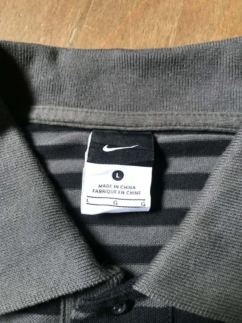 Nike polo Manchester stripes (Category: Tshirts & Polo Shirts ) located in Manila. Submitted by thriftnicarl.3 (Listing ID 1464916005, Image 3). Description: Nike polo stripes Manchester united sizes - large dimes - W 20.5 L 28.7 price - 499 Free ship via jnt 🏷️.