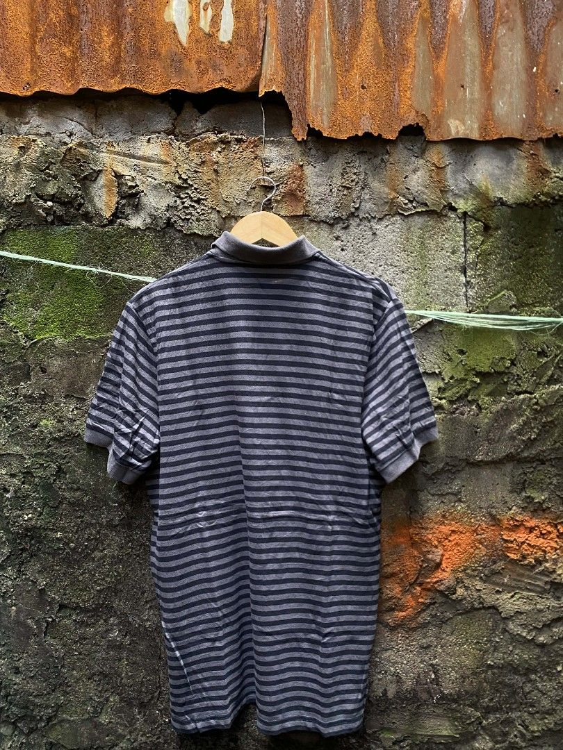 Nike polo Manchester stripes (Category: Tshirts & Polo Shirts ) located in Manila. Submitted by thriftnicarl.3 (Listing ID 1464916005, Image 2). Description: Nike polo stripes Manchester united sizes - large dimes - W 20.5 L 28.7 price - 499 Free ship via jnt 🏷️.