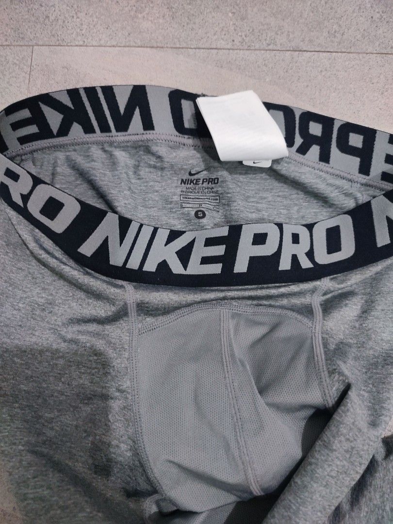 Nike Pro Warm Men's Tights Grey Size S (Category: Activewear) located in Taguig. Submitted by thriftzzzy (Listing ID 1464882473, Image 3). Description: - Brand: Nike Pro - Item: Warm Tights / Leggings - Color: Grey - Size: Small (S) - Thick elastic waistband with bold branding - Breathable mesh panels at crotch and thighs for ventilation - Subtle Nike swoosh logo on lower left leg - Ideal for gym workouts, running, or cold weather layering - Cond