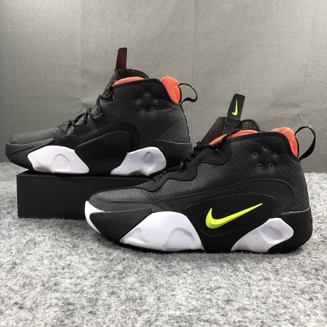 Nike ReactNike react frenzy Size Us 10 (Category: Sneakers) located in Mandaluyong City. Submitted by bethco (Listing ID 1464833359, Image 2). Description: - Brand: Nike - Model: React Vision - Colorway: Black with neon yellow swooshes and bright orange interior lining - Sole: Chunky white and black foam sole with unique organic shapes - Features: Dark textured mesh, synthetic overlays, tongue/heel pull loops, and reflective markings - Inclusions