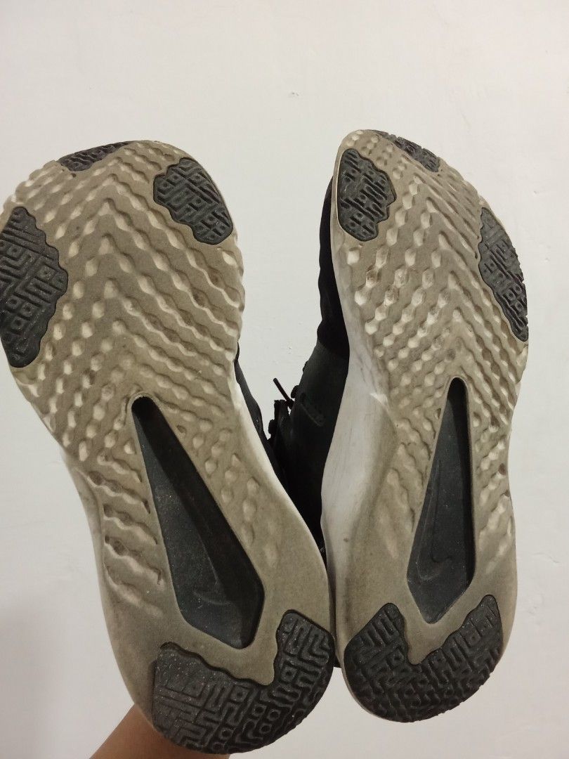 Nike Renew Black Athletic Sneakers (Category: Sneakers) located in Quezon City. Submitted by jane019 (Listing ID 1464916124, Image 3). Description: - Brand: Nike Renew - Color: Black with white soles - Material: Breathable mesh upper - Comfort: Cushioned foam sole for solid support during runs and workouts - Fit: Secure lace-up closure - Condition: Good structural condition with great grip on bottom treads; minor dirt on soles from previous wear 