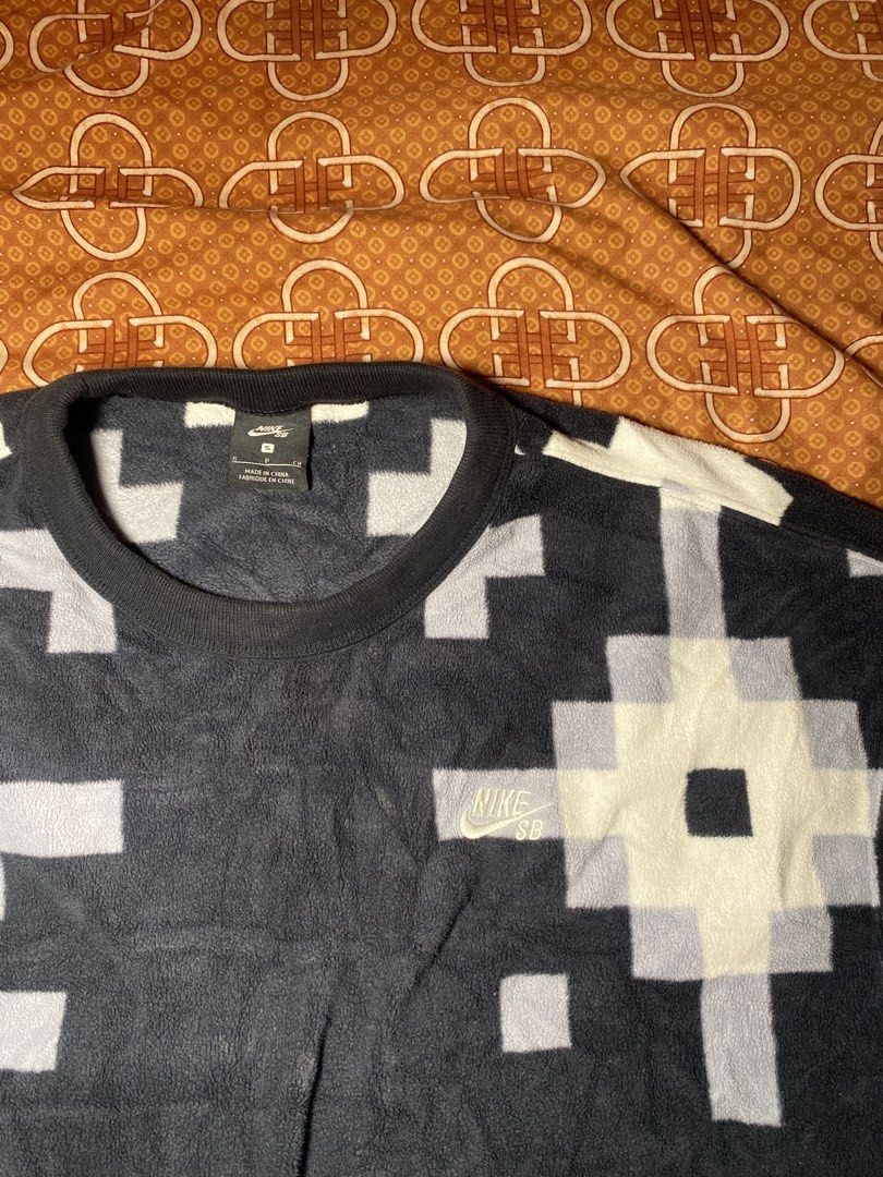 Nike SB Pixel Pattern Fleece Sweatshirt Size S (Category: Coats, Jackets and Outerwear) located in Las Pinas. Submitted by john.ross.sayoc.30-82096 (Listing ID 1464967091, Image 2). Description: Nike SB fleece sweatshirt in black and white. Pixelated block pattern all over the body and sleeves. Crewneck collar with ribbed cuffs and hem. Front zip pocket built right into the design. Size small tag attached inside the collar. Made in China..