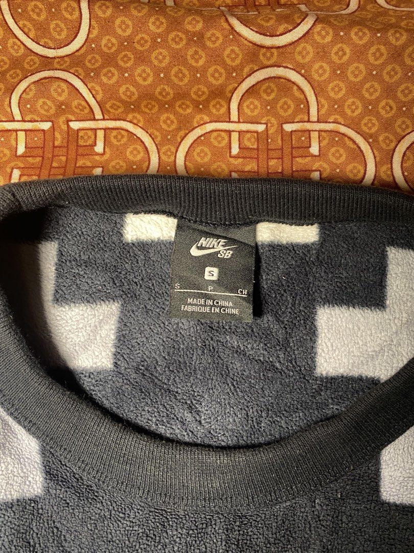 Nike SB Pixel Pattern Fleece Sweatshirt Size S (Category: Coats, Jackets and Outerwear) located in Las Pinas. Submitted by john.ross.sayoc.30-82096 (Listing ID 1464967091, Image 3). Description: Nike SB fleece sweatshirt in black and white. Pixelated block pattern all over the body and sleeves. Crewneck collar with ribbed cuffs and hem. Front zip pocket built right into the design. Size small tag attached inside the collar. Made in China..