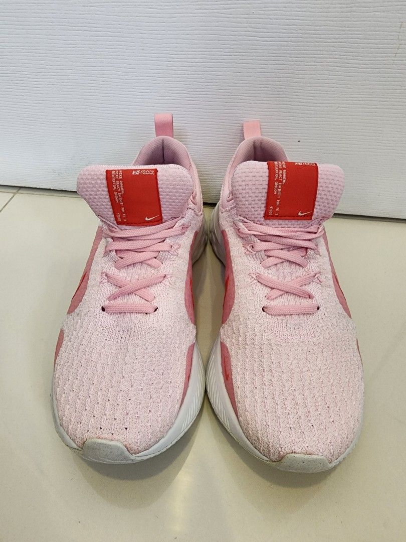 Nike Women's React Infinity Run Flyknit 3 Size 7.5 (Category: Sneakers) located in Quezon City. Submitted by pinkyshang (Listing ID 1464865918, Image 1). Description: - Brand/Model: Nike Women's React Infinity Run Flyknit 3 Size 7.5 - Colorway: Pink with striking Red Swoosh and Red Tongue Label - Sole: Cushioned White and Grey React foam with light wear on bottom tread - Upper: Breathable knit material with matching Pink laces and padded collar -